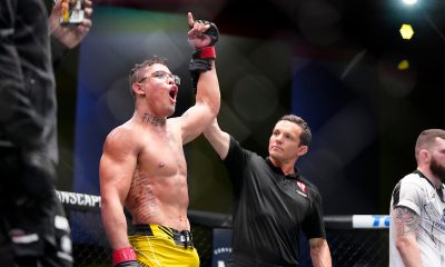 Com o braço erguido pelo árbitro, Caio Borralho comemora vitória no UFC Vegas 72