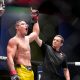 Com o braço erguido pelo árbitro, Caio Borralho comemora vitória no UFC Vegas 72