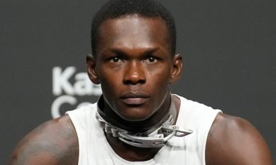 Israel Adesanya explica uso de coleira na coletiva de imprensa do UFC 287 para luta contra Alex Poatan.