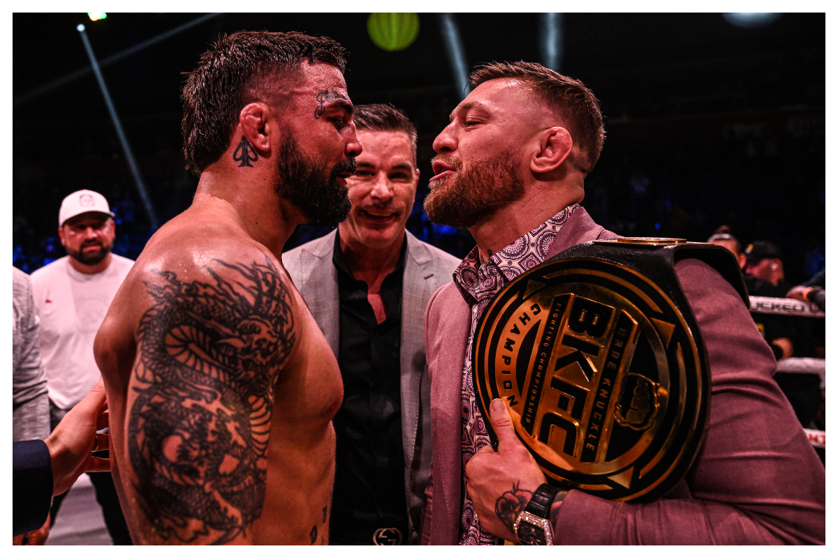 Com o cinturão do evento de boxe sem luvas no ombro, McGregor faz encarada com Mike Perry