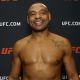 César Almeida sorridente após vencer sua estreia no UFC.