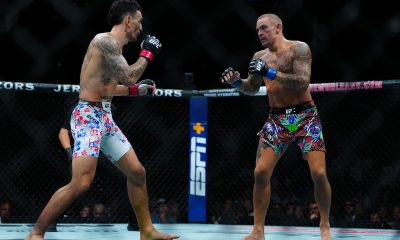 Max Holloway e Dustin Poirier durante confronto no UFC 318