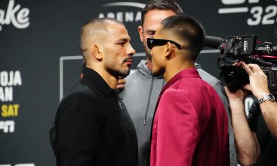 Alexandre Pantoja e Joshua Van se encarando após a coletiva de imprensa do UFC 323