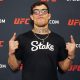 Com o óculos da Fighting Nerds, Caio Borralho posa após vitória no UFC 326